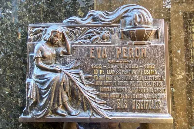 Eva Perón's remains are finally laid to rest in the Duarte family tomb in La Recoleta Cemetery in Buenos Aires, Argentina. The tomb is sealed, and Eva is interred next to her family members.