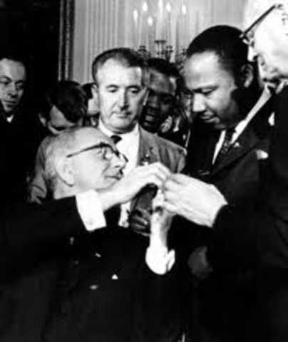 Johnson signs the Civil Rights Act of 1964