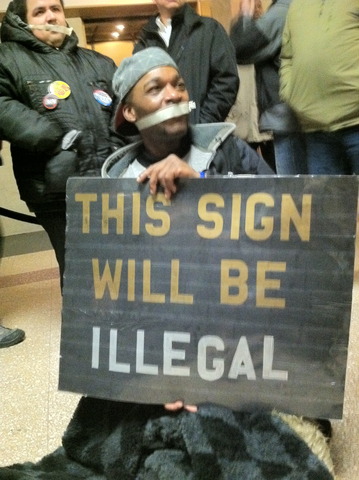 3 protesters in gallery of City Hall disrupt voting process chanting: We vote no! Security escorted men out. #citycouncil #NATO #protests