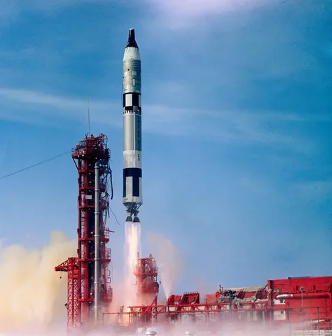 First propulsion maneuver with docked Agena (Gemini X)