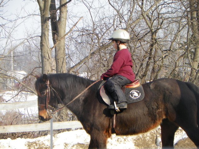 Riding on a pretty horse.