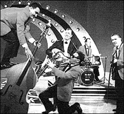 Bill Haley and the Comets  launched a hit called Rock Around the Clock