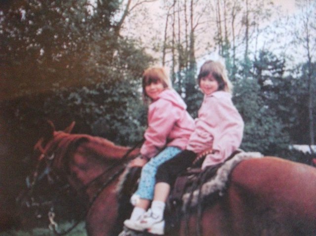 me and my sister growing up riding horses