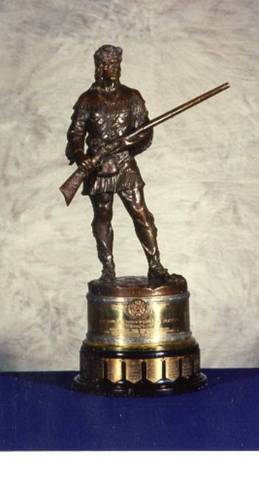 Annie starts  shooting game in the woodsand selling it to be greenville shopkepper