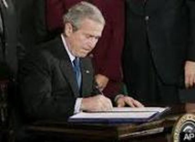 George bush signs a energy bill.
