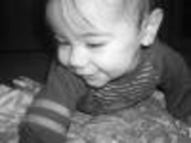 Infant begins to crawl.