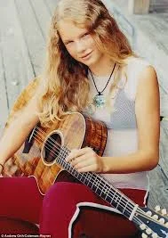 Taylor First Learns To Play Guitar