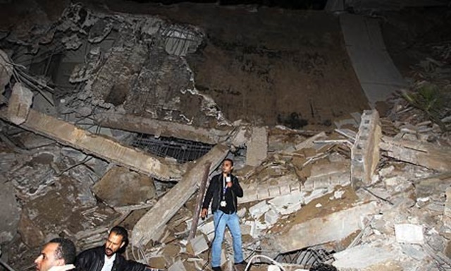 Gaddafi compound hit by coalition air strikes on Tripoli