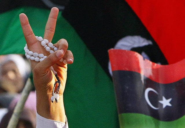 National Transitional Council announces liberation to elated crowds in city where uprising began