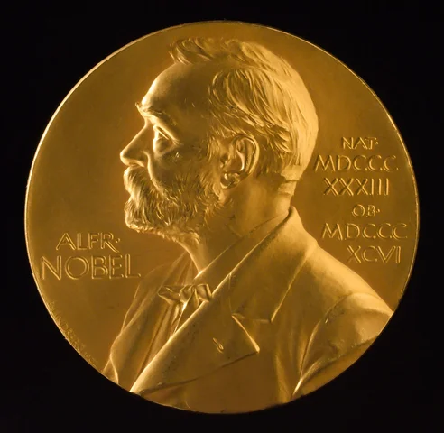 Is awarded the Nobel Prize