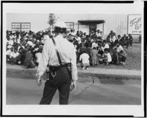 Nine Black students intgrate with white students.
