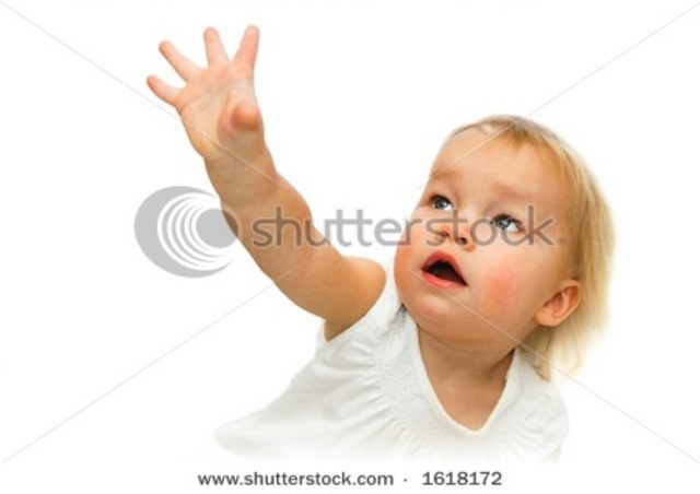 A baby can hold its head up and reach for objects.