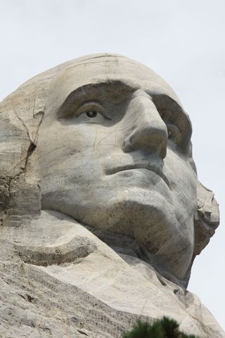 A baby can hold its head up and reach for objects.