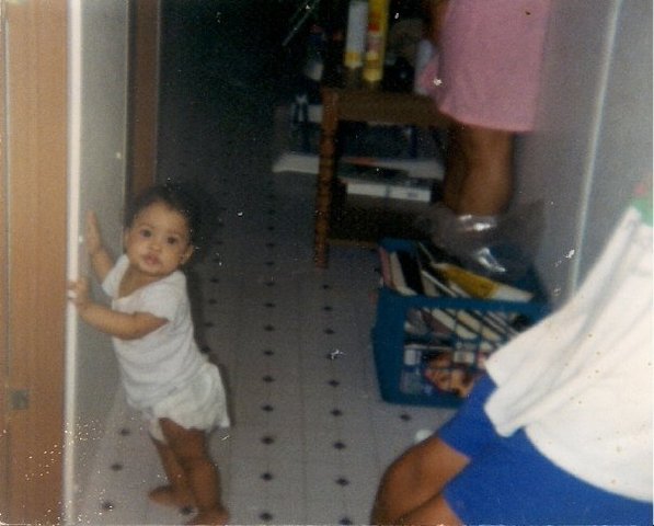 A baby can hold its head up and reach for objects.