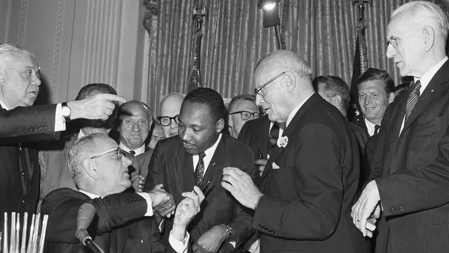 The Civil Rights Act of 1964 signed by President Johnson