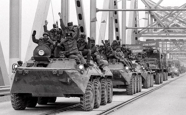 The Soviet union withdraws troops from Afghanistan, Romanian uprising ousts Nicholae Ceausescu and his wife, and the USSR allows the dismantling of the Berlin Wall