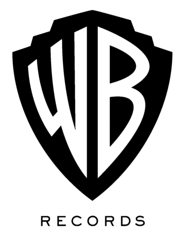 R.E.M. signs with Warner Brothers