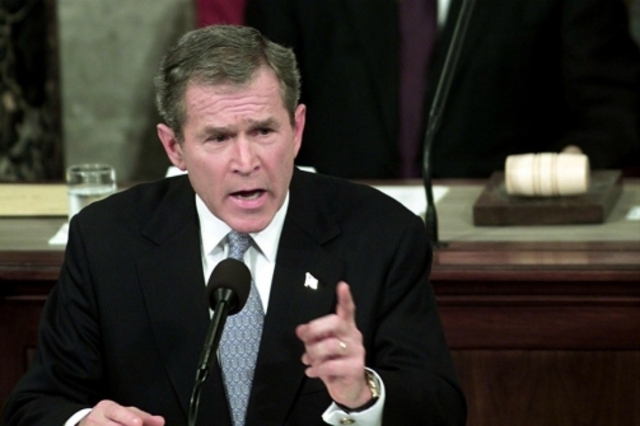 President Bush's first State of the Union address vows to expand the fight on terrorism and labels Iran, Iraq, and North Korea "an axis of evil"