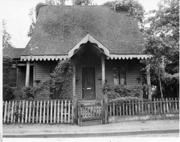 Hoag House a mustard yellow home built in Gothic Revival style on B and First Street by Charlie White.