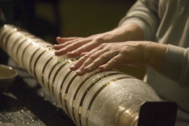 Benjamin Franklin improves the glass harmonica