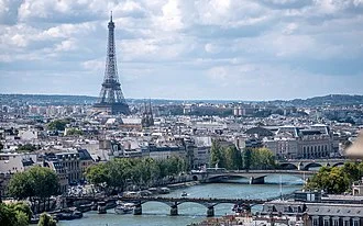 Moves to Paris, France