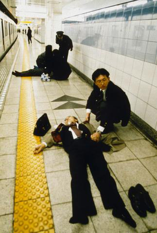 Aum Shinrikyo gasses subway in Tokyo