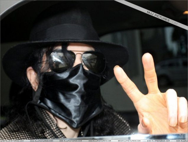 Michael begins to wear a surgical mask in public.