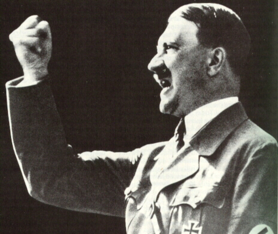 Hitler ignores the Versailles Treaty and begins to conscript troops into the expanding German Army