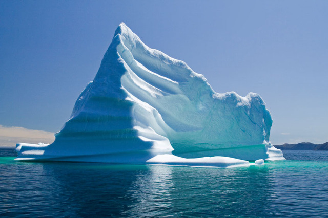 An iceberg scrapes the Titanic