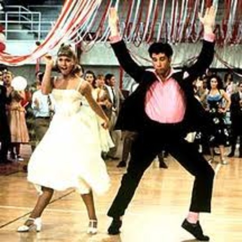 "Grease" starring John Travolta & Olivia Newton-John opens