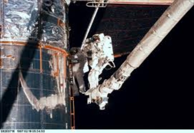 2nd Servicing Mission; Space Shuttle Discovery, replaced the original spectrographs, and near-infrared cameras with more powerful instruments