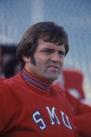 Ron Meyer hired as head football coach.