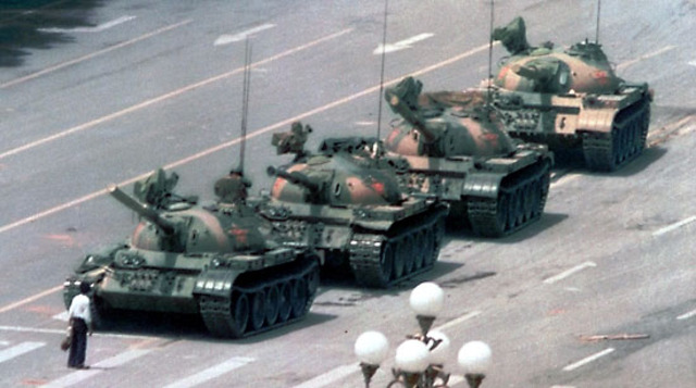 Tank man holds his ground in front of tanks in response to events of the past two days in Bejing