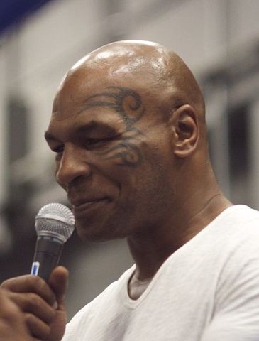 Mike Tyson KOs Carl Williams in 1:33 for heavyweight boxing title