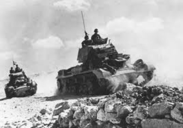 British and US forces defeat German and Italian 	armies in North Africa