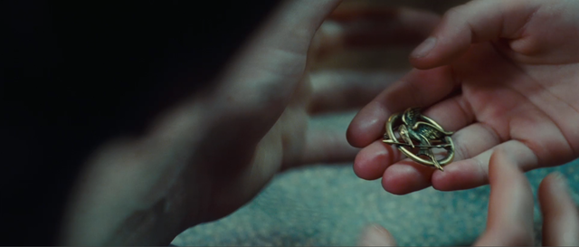 Prim Gives Katniss The Mockingjay-ac7724
