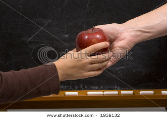 Billy gives his teacher an apple