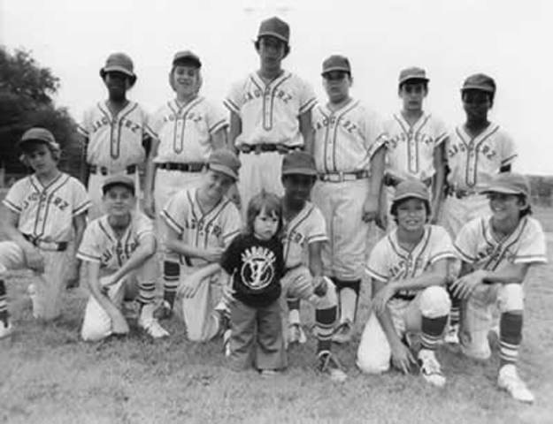 Girls playing in Little League baseball