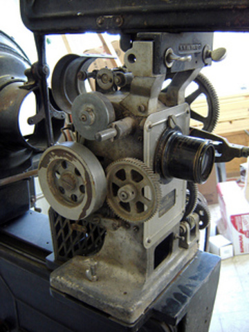 1st public screening of a movie from a film projector