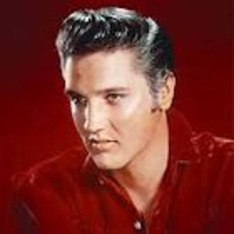 Elvis Presley signs with RCA Records