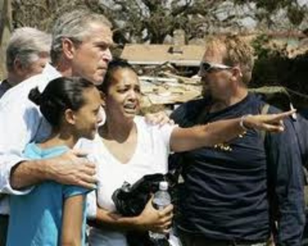 Bush views the devastation of a hurricane