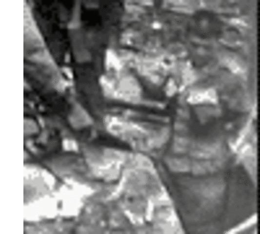 An American soldier examines a supply cache