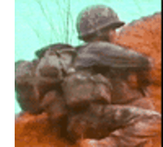 A South Vietnamese soldier crouches behind a hill in Operation Lam Son 719