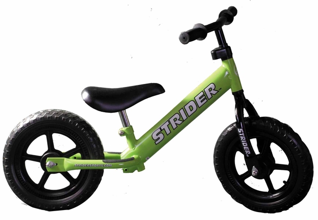 Fudge gets on the Toddle-Bike comershl.