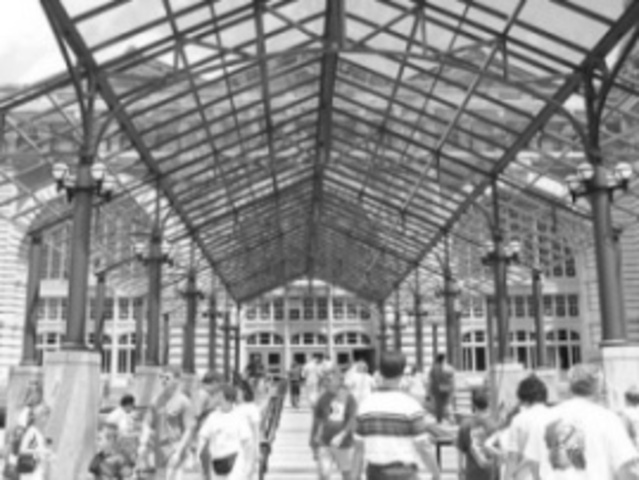 People entering the front gate of Ellis Island