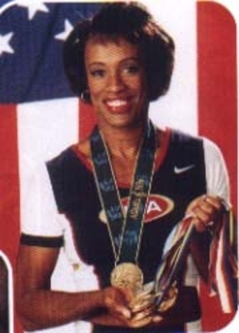 Jackie Joyner-Kersee wins gold and breaks world record