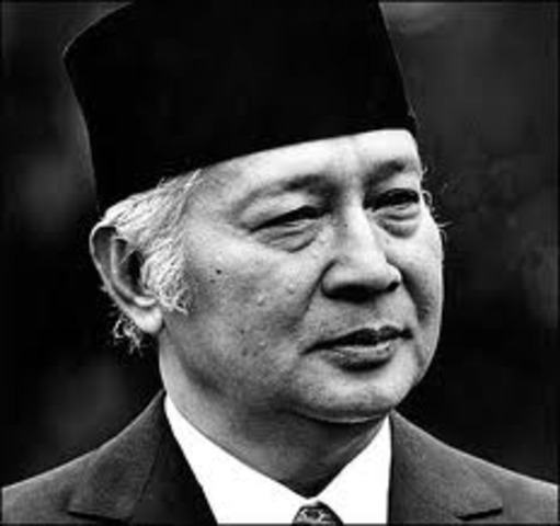 Sukarno hands over emergency powers to General Suharto, who becomes president