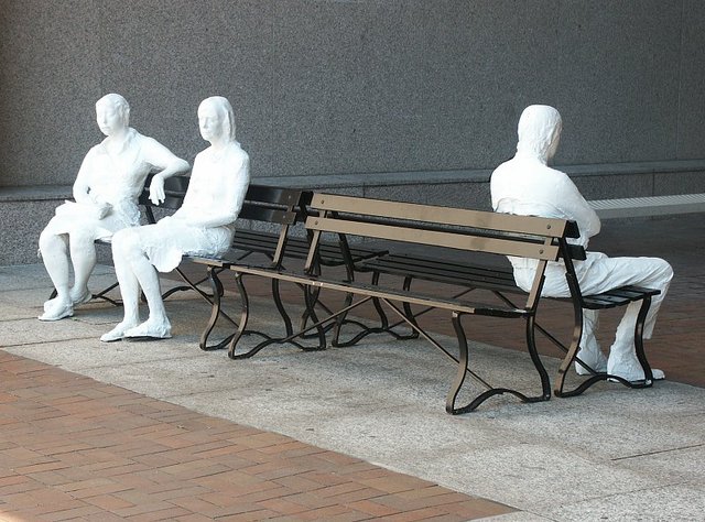 George Segal creates "Three Figures on Four Benches"