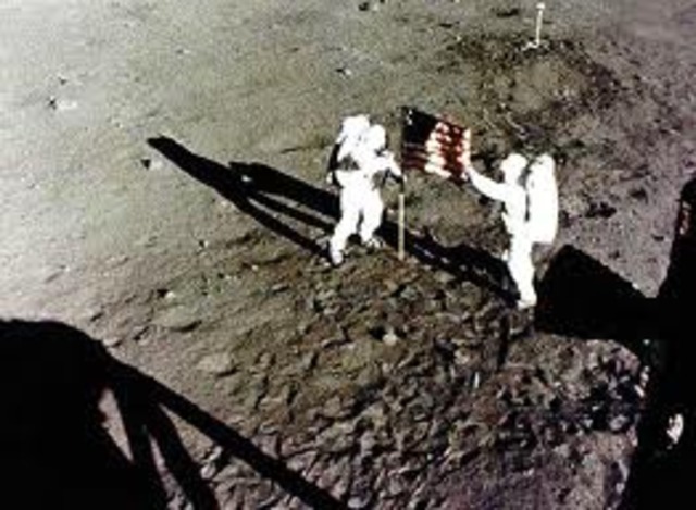 The United States' Neil Armstrong and Edwin "Buzz" Aldrin become the first men to walk on the Moon