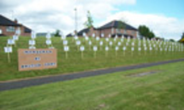 a Roman Catholic doorman at a Belfast night club and nephew of Gerry Adams, is killed.